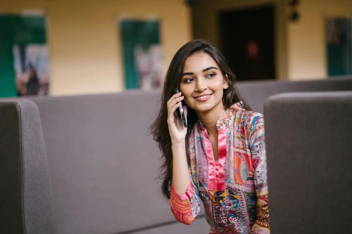 photo-of-smiling-woman-talking-on-phone-2559050